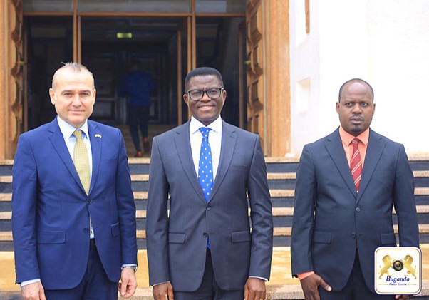 The Katikkiro is in the middle, with Ambassador Mehmet Fatih on the left and Honourable Israel Kazibwe Kitooke on the right