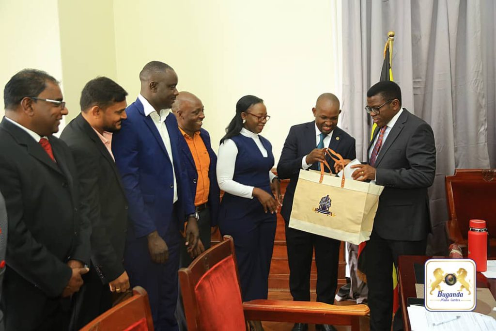 Alcohol Industry Association members, presenting a gift to the Katikkiro