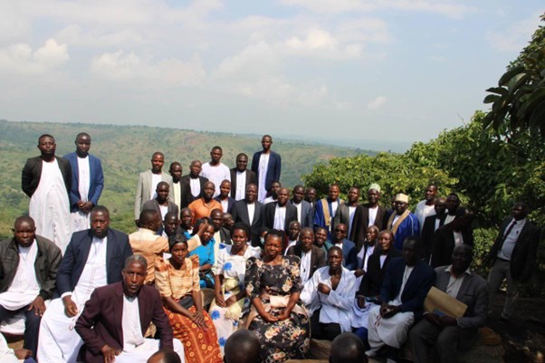Group photo at the Kiwere clan home with Kiwere clansmen. Image